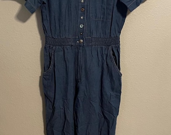Vintage damesjumpsuit maat medium, blauw denim, met knoopsluiting aan de voorkant, western cowgirlstijl uit de jaren 90.