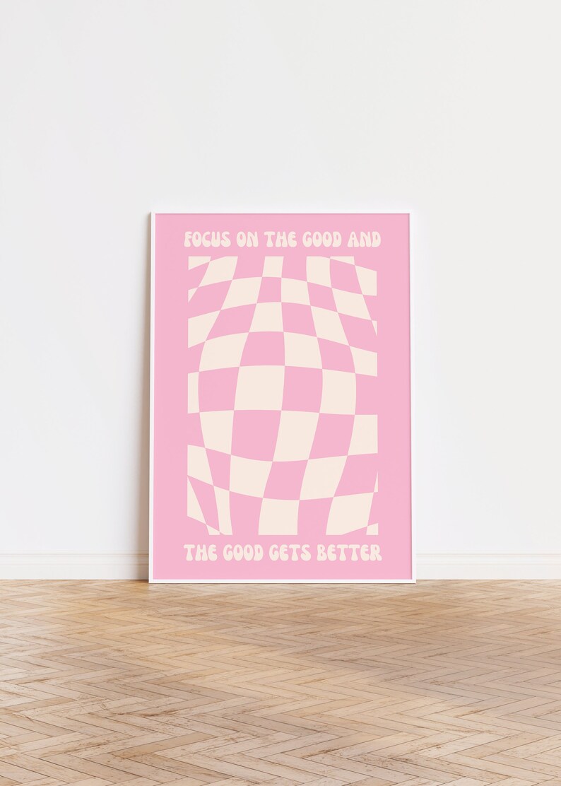 May include: Pink and white checkered pattern poster with the text "Focus on the good and the good gets better".