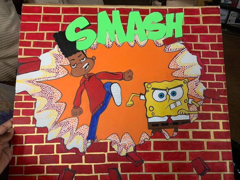Peut inclure: Une peinture sur toile carr&eacute;e repr&eacute;sentant un mur de briques rouges en train d'&ecirc;tre fracass&eacute;. Le mot SMASH est &eacute;crit en grandes lettres vertes en haut. &Agrave; l'int&eacute;rieur du trou, un personnage de dessin anim&eacute; en sweat rouge et Bob l'&eacute;ponge apparaissent.