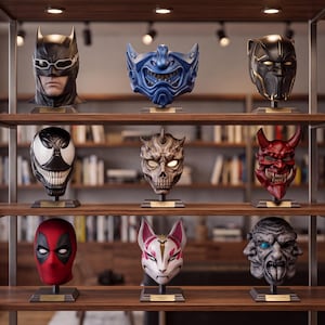 Premium display of detailed 3D mask models with a large blue fantasy mask centered among red, black, white and skull inspired designs.
