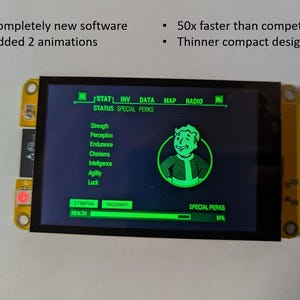 May include: A small, yellow-framed electronic device with a black screen displaying a green interface. The screen shows text including "STATUS SPECIAL PERKS" and a cartoon character. The device is connected to a black cable. Text on the screen reads "Completely new software", "Added 2 animations", "50x faster than competitors", and "Thinner compact design".