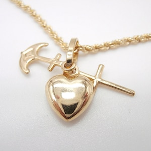 18kt yellow gold necklace with 18 kt yellow gold pendant faith hope and charity boxed with laser rope type chain