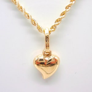 18K gold necklace third measure laser rope 1.6 mm wide. and 45 cm long with boxed and stylized heart pendant length 10 mm. width 8mm.