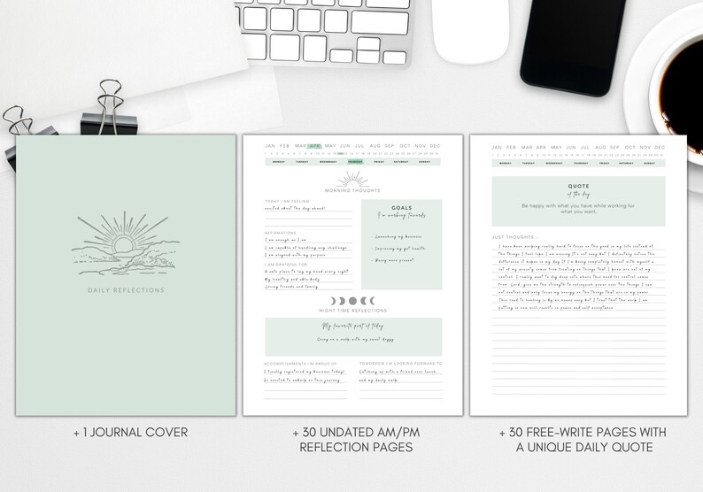 May include: A mint green journal with the words "Daily Reflections" and a sun graphic. The journal includes undated reflection pages and free-write pages with daily quotes. The journal is shown with a keyboard, phone, and coffee cup.