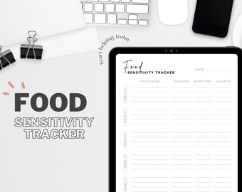 May include: A digital food sensitivity tracker on a tablet. The screen displays a form with sections for food/drink, triggers, symptoms, and severity. The words "Food Sensitivity Tracker" are at the top. A cup of coffee, a phone, and a keyboard are also visible.