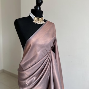Grey soft silk saree with a copper border and all over sheen. Kubera pattu Sarees for wedding parties events pattu sarees for bridesmaids