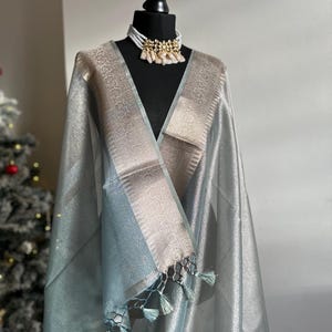 Ice grey shimmer soft tissue saree with border and unstitched blouse. Soft grey wedding guest party traditional saree unique saree look