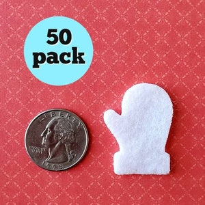 May include: A pack of 50 white felt mitten shapes. The mittens are about the size of a quarter.