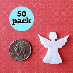 May include: A pack of 50 white felt angel shapes, each about the size of a US quarter. The angels are cut out and ready to be used for crafts or decorations.