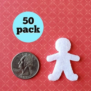 May include: A pack of 50 white felt cutouts shaped like people. The cutouts are about the size of a US quarter.