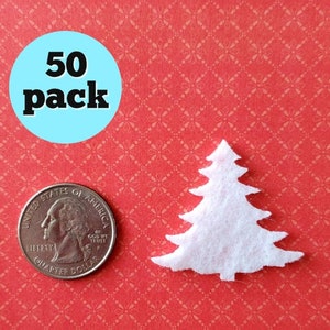 May include: A pack of 50 white felt Christmas tree shapes. The trees are about the size of a US quarter.