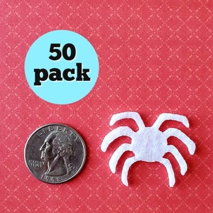 May include: A pack of 50 white felt spider cutouts. The spiders are about the size of a US quarter.