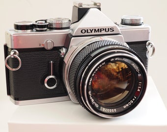 Olympus OM-1n analog 35mm film camera in excellent condition! Cleaned, adjusted, tested, guaranteed