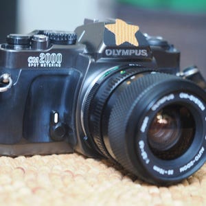 Olympus OM2000 35mm analog SLR film camera with 35-70mm Olympus lens - cleaned, fully tested and guaranteed!