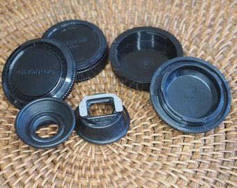 Olympus OM analog film camera eyecup, lens caps, hot shoe and other accessories