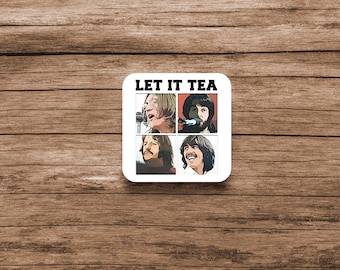 May include: A white square coaster with a black border and the text "LET IT TEA" printed in black. The coaster features four images of the Beatles, each in a separate square.