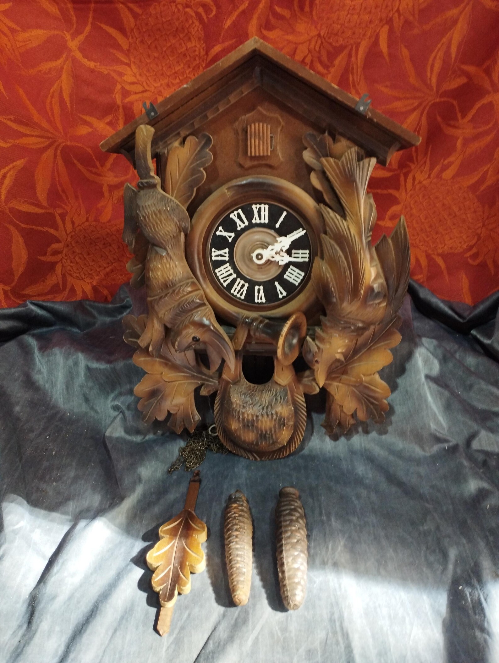 old black forest cuckoo clock with pendulum and weight