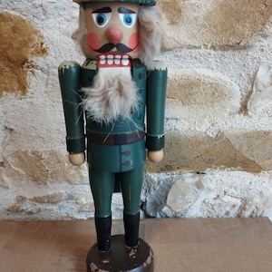old wooden nutcracker toy early 20th century