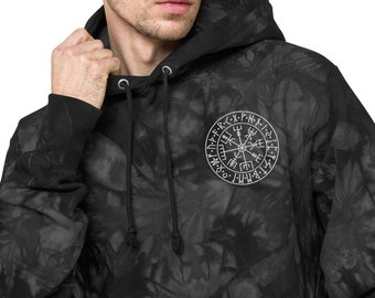 May include: Black and gray tie-dye hoodie with a white circular emblem on the chest. The emblem features a runic compass design. The hoodie has a drawstring hood and ribbed cuffs.