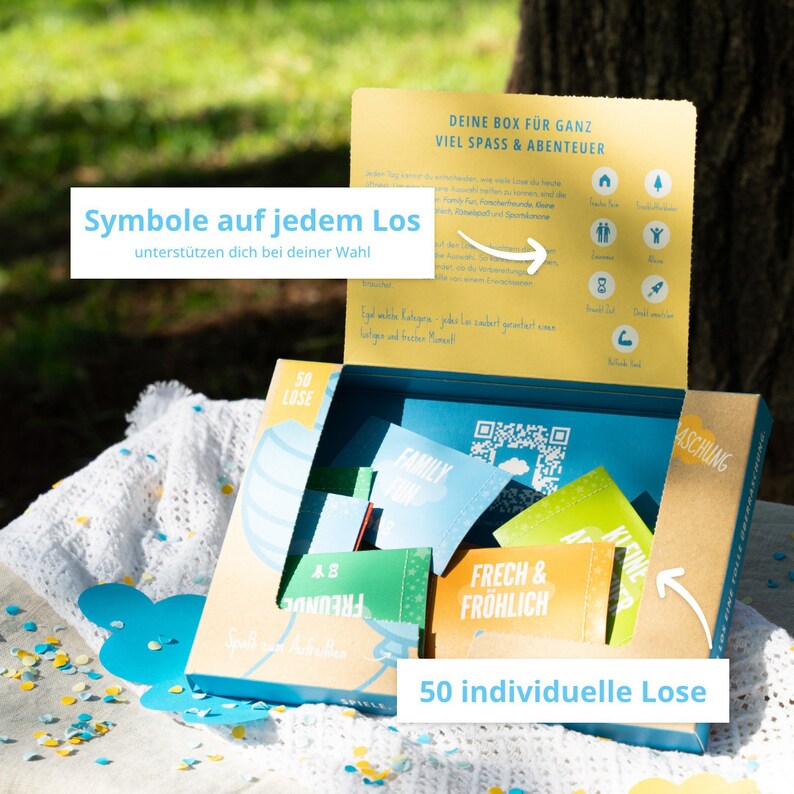 Geöffnete AMARI Losbox für Kinder, jedes Los mit Symbolen für einfache Auswahl – 50 Wege, Kinderfreude zu entfachen.