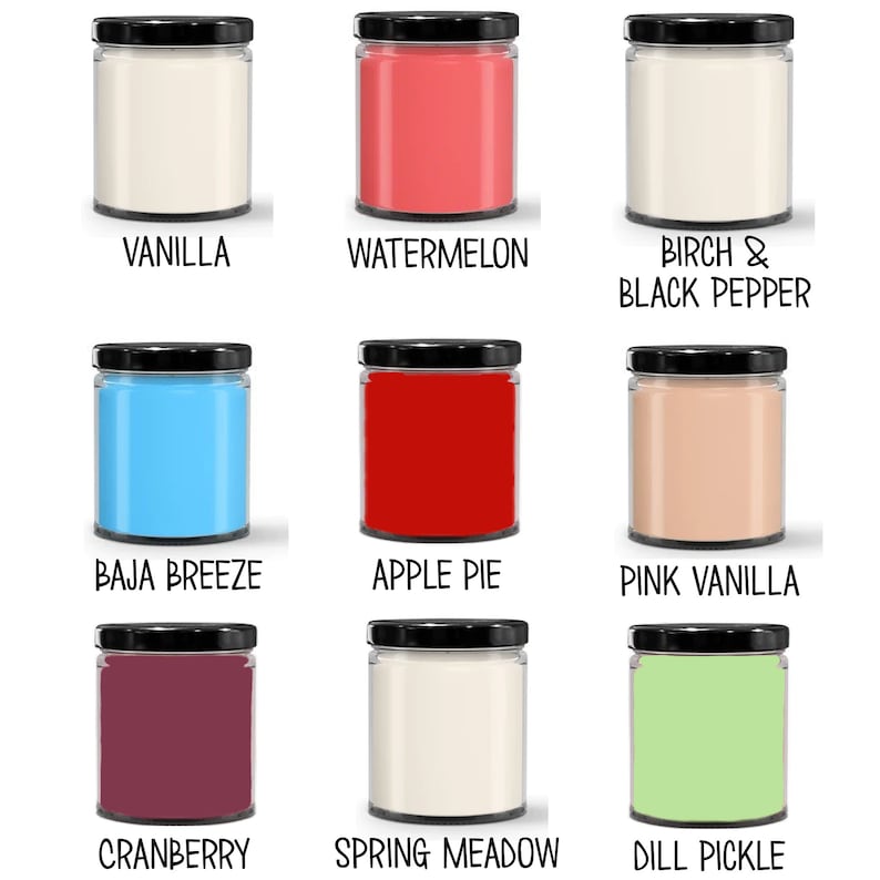 May include: Nine glass candle jars with black lids and various colored waxes. The labels on the jars read: Vanilla, Watermelon, Birch & Black Pepper, Baja Breeze, Apple Pie, Pink Vanilla, Cranberry, Spring Meadow, and Dill Pickle.