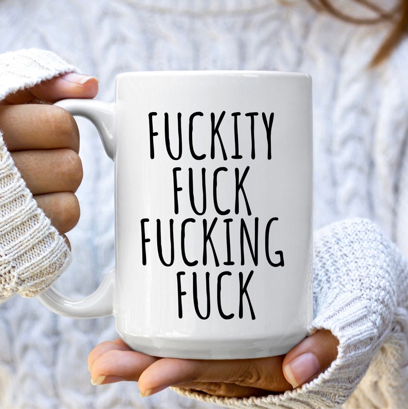 May include: White ceramic coffee mug with black text that reads "F*ckity F*ck F*cking F*ck".