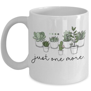 May include: White ceramic mug with a black outline of potted succulents and the text "just one more."