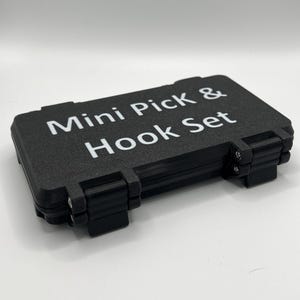 May include: A black, rectangular case with the words "Mini Pick & Hook Set" printed in white on the top.