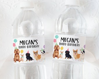 May include: Two clear plastic water bottles with personalized labels. The labels feature a colorful illustration of dogs wearing party hats and the text "Megan's Third Birthday".