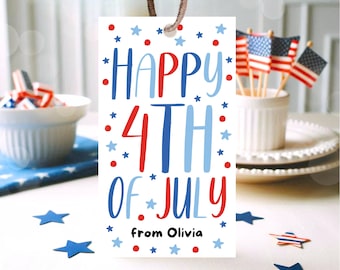 May include: A white tag with the text "HAPPY 4TH OF JULY" in red and blue, with star and dot accents. The tag is tied with a brown string. Additional decorations include miniature American flags and star-shaped confetti.