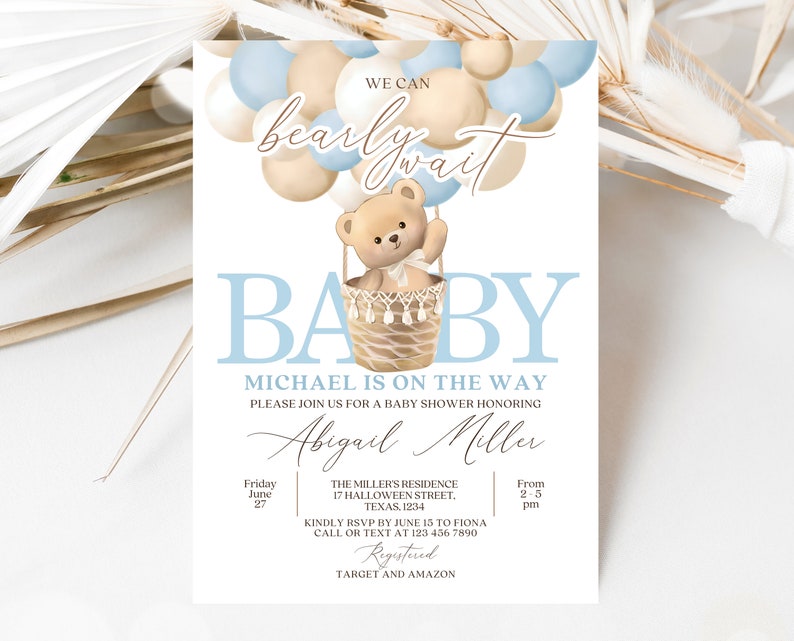 May include: A baby shower invitation with a blue and beige color scheme. The invitation features a teddy bear in a hot air balloon made of balloons. The text on the invitation reads "We can barely wait Baby Michael is on the way. Please join us for a baby shower honoring Abigail Miller. Friday June 27 From 2-5 pm. The Miller's Residence 17 Halloween Street, Texas, 1234. Kindly RSVP by June 15 to Fiona Call or text at 123 456 7890 Registered Target and Amazon."