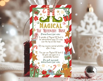 May include: A white card with red and green stripes and a Christmas elf design. The card reads "Magical Elf Recovery Dust" and includes instructions for use.