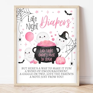 May include: A printable sign with a pink and black Halloween theme. It says "Late Night Diapers" with a cauldron and ghosts. The text reads "Late Night Diaper's Must Be Done! But here's a way to make it fun! A word of encouragement, a giggle or two, give the parents a note just from you!"