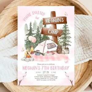 May include: A pink and brown invitation for a 7th birthday party with a camping theme. The invitation features a cartoon illustration of a tent, a campfire, and a sign that says "Meghan's Camp". The text on the invitation reads "You're Invited to Meghan's 7th Birthday, June 27-31, 2 PM, Summer Camp & Cottages, 17 Party Street, Mountain Campings Avenue, Stand No. 3-5, Texas, 1234, RSVP to Linley -12 345 6798".