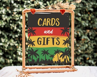 May include: A copper pipe stand with a sign that says "Cards and Gifts" in black text on a black background. The sign has a green, yellow, and red background with palm trees and a city skyline.