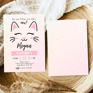 May include: Pink and white birthday invitation with a cartoon cat illustration. The text reads "Are you kitten me right meow? Megan is turning 5. October 23, 1-6PM. Megan's Lovie, 11 Party Street, Puppy Avenue, Doggy Manor, NY, 15, 114. RSVP to [phone number]"