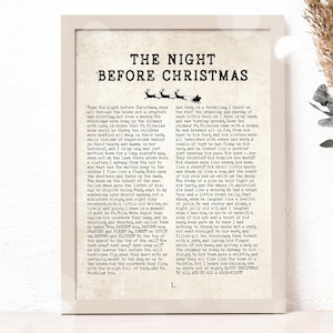 Pode incluir: Uma impressão de estilo vintage do poema "Twas the Night Before Christmas" de Clement C. Moore. O poema está impresso em tinta preta sobre um fundo creme. O poema está emoldurado em uma moldura preta simples.