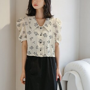 Babyhug Woven Half Puffed Sleeves Peter Pan Collared Cropped Top with Floral Print - White