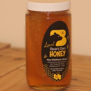 Pure Pennsylvania honeycomb and liquid honey in a one-pound jar