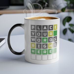 May include: White ceramic mug with a black handle. The mug has a black and white word search puzzle design that says "PLACE YOUR WORDS RIGHT HERE".