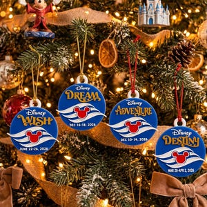 May include: Four round blue ornaments hanging on a Christmas tree. Each features a white wave graphic, a red Mickey Mouse icon, and text: Disney Wish June 22-18, 2026, Disney Dream Dec 14-18, 2026, Disney Adventure Dec 10-14, 2026, and Disney Destiny Mar 28-Apr 2, 2026.