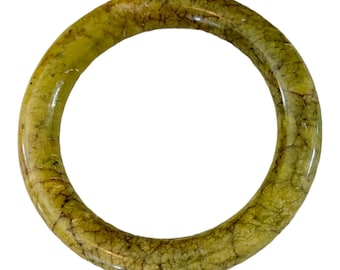 May include: A green jade bangle with a marbled pattern.
