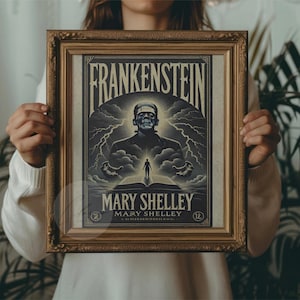 May include: A framed vintage print with the title "Frankenstein" above an illustration of the monster. The print also includes the author's name, Mary Shelley, and is in a gold-coloured frame. The artwork has a vintage aesthetic.