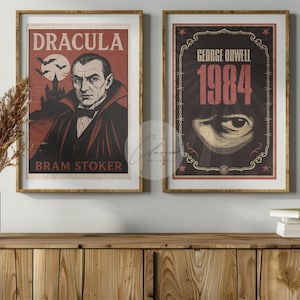 May include: Two framed vintage posters. The left one features Dracula with the text "Dracula" and "Bram Stoker." The right poster displays "George Orwell 1984" with an eye graphic. Both are in gold frames, displayed on a wooden cabinet.