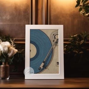 May include: A framed print featuring a vintage turntable with a blue vinyl record. The artwork is set against a warm, dark background with a vase of white roses and greenery. The print is in a white frame.