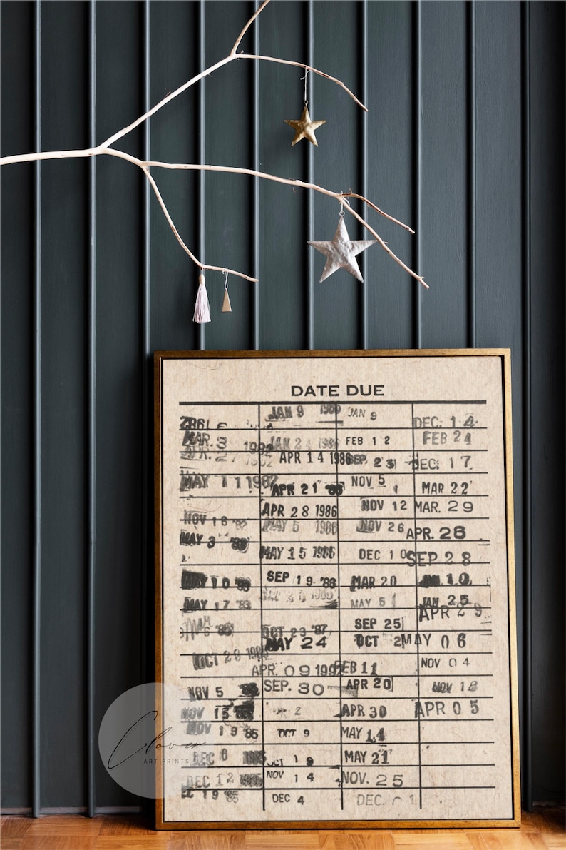 May include: A vintage-style print of a date due calendar with handwritten dates in black ink on a beige background. The print is framed in a gold-colored frame.
