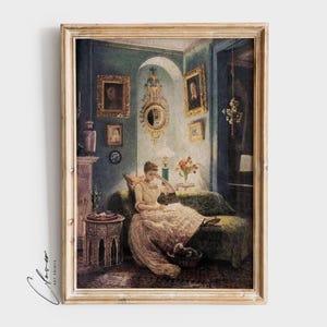 May include: A framed painting of a woman in a white dress sitting on a couch in a room with a blue wall and several framed pictures. The woman is reading a book and there is a lamp on a table next to her.