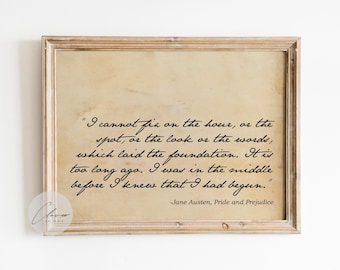 May include: A framed print featuring a quote from Jane Austen's "Pride and Prejudice." The text is in black script on a parchment-toned background, set within a light brown wooden frame. The quote reads, "I cannot fix on the hour..."