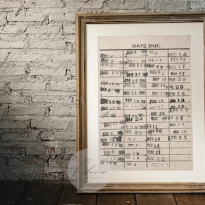 May include: A framed vintage calendar with a handwritten date due list. The calendar is printed on a cream-colored paper with black ink. The dates are listed in a grid format with the months of January, February, March, April, May, June, July, August, September, October, November, and December.
