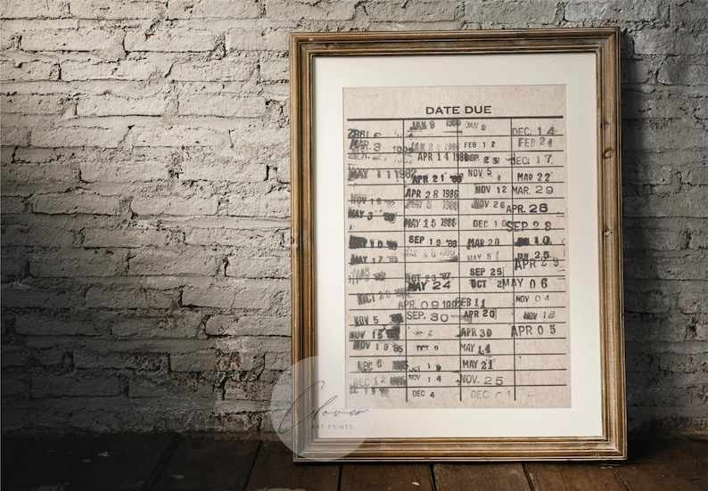 May include: A framed vintage calendar with a handwritten date due list. The calendar is printed on a cream-colored paper with black ink. The dates are listed in a grid format with the months of January, February, March, April, May, June, July, August, September, October, November, and December.